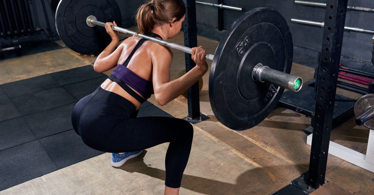 Back View of Woman in Shoulder Squat,.