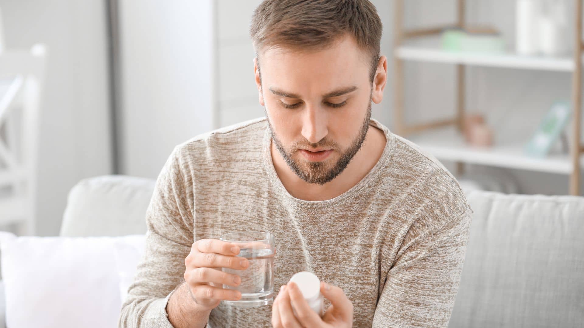 A young man taking drug at home