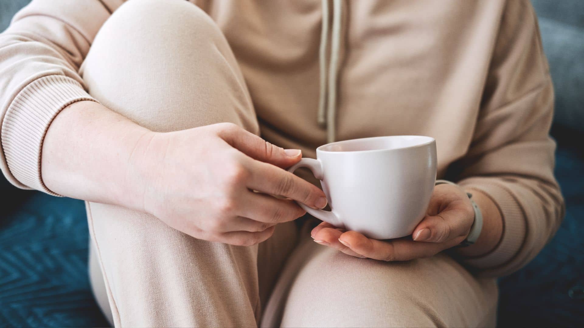 Self care, staying home, cozy mood. Take care of yourself, Love yourself concept. Woman hands with cup of hot drink at home