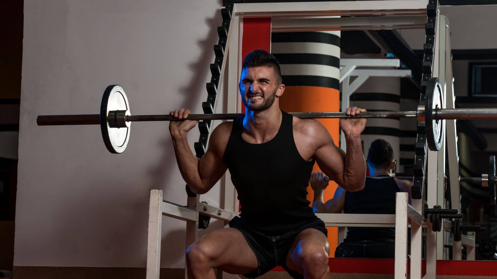 man doing Barbell back squat