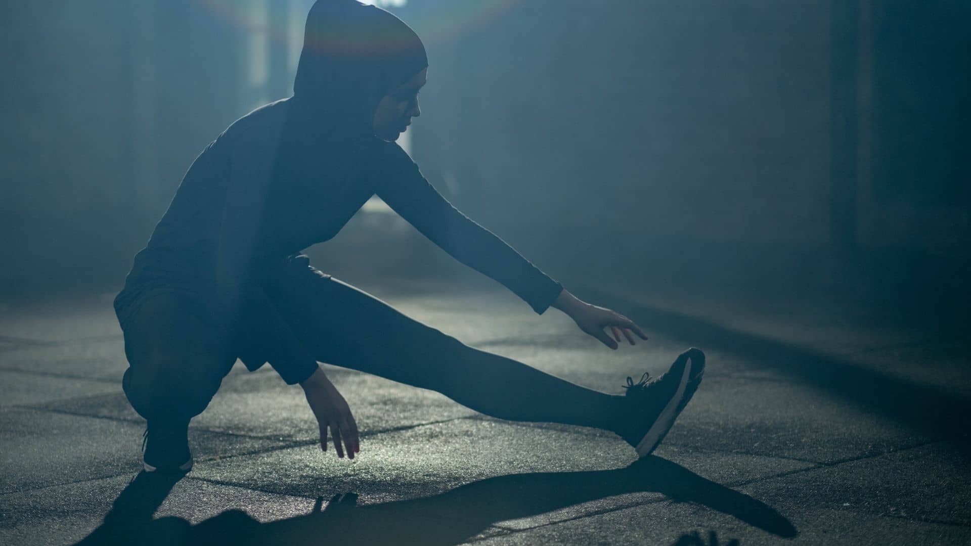 Woman in Black Activewear Exercising