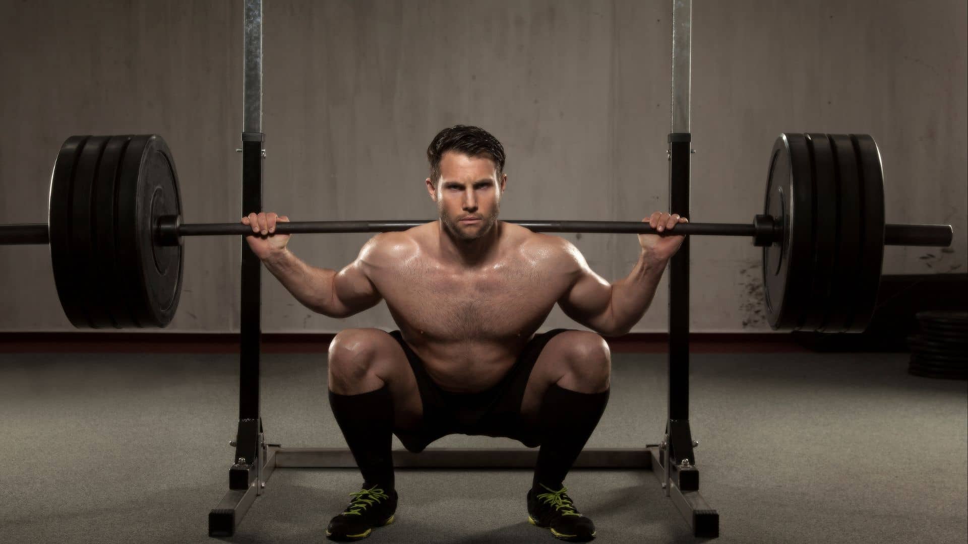 Athlete performing squat with barbell