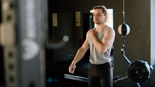 Man in Gray Tank Top at the Gym