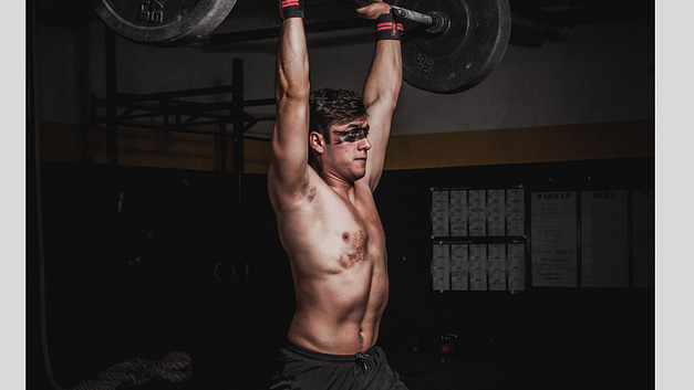 Man Lifting A Barbell