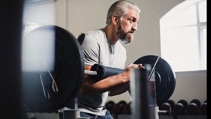 Mid-Adult Man Performing a Zercher Squat