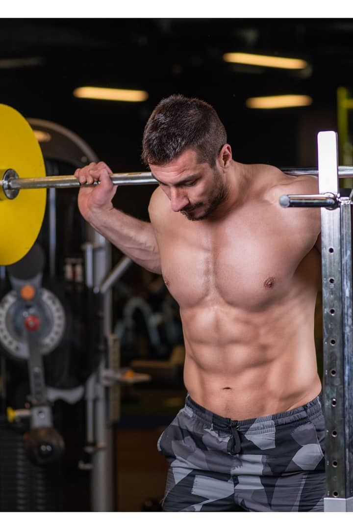 Man Doing Squats with Bar