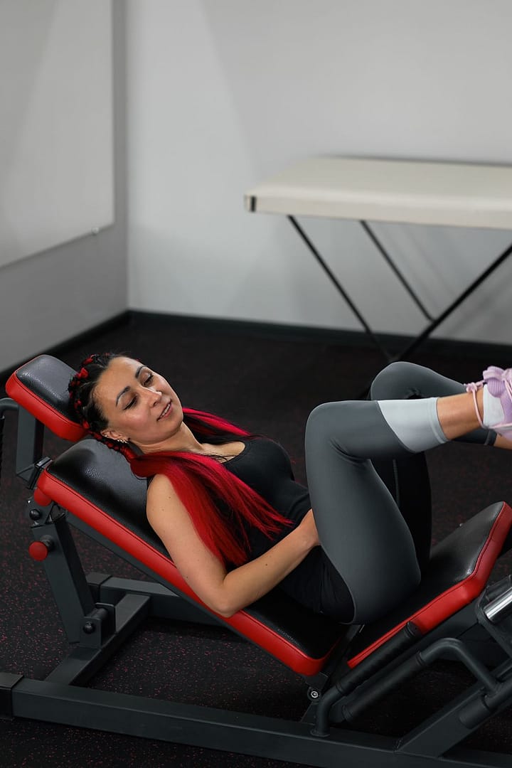 Woman on a Leg Press Machine in the Gym