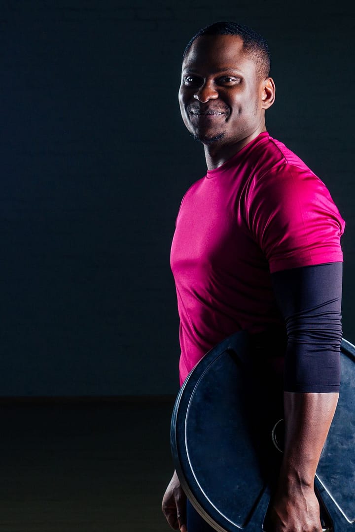 young african american man sportsman squatting sportsman exercis
