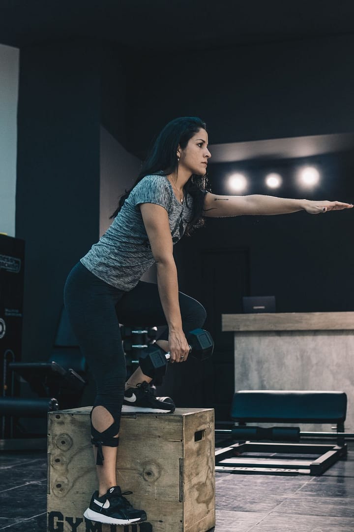 Woman Stepping One Leg on Exercise Box