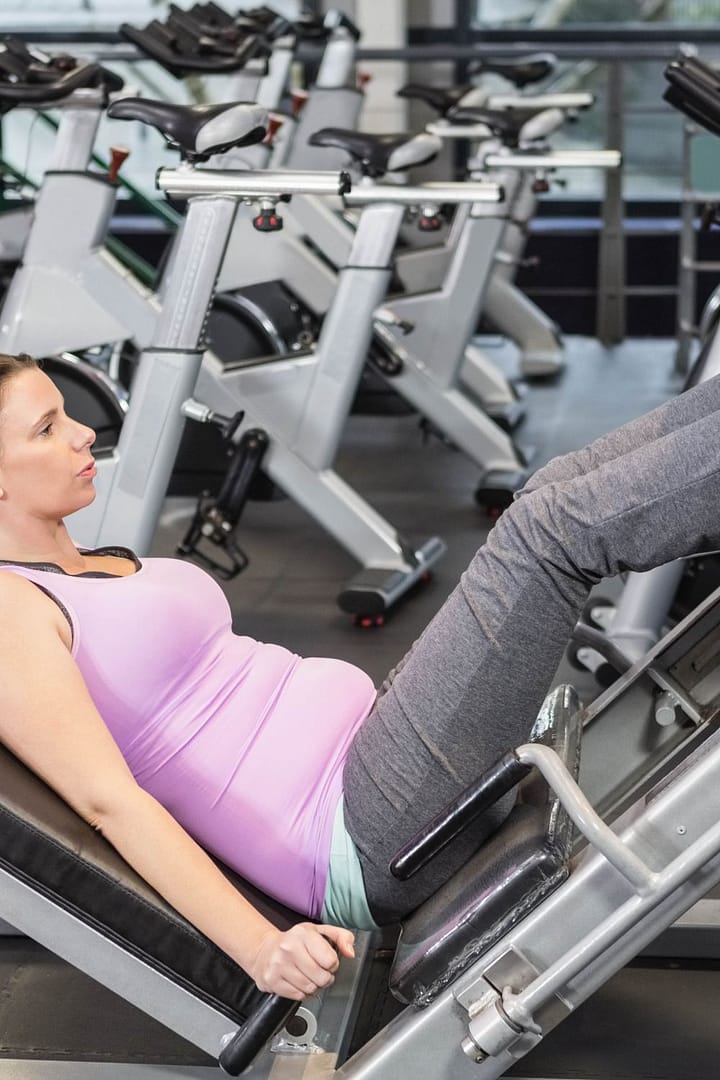 Woman using leg press