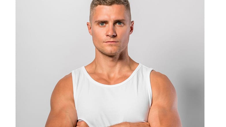 front-view-fit-man-posing-while-wearing-tank-top-with-crossed-arms.jpg