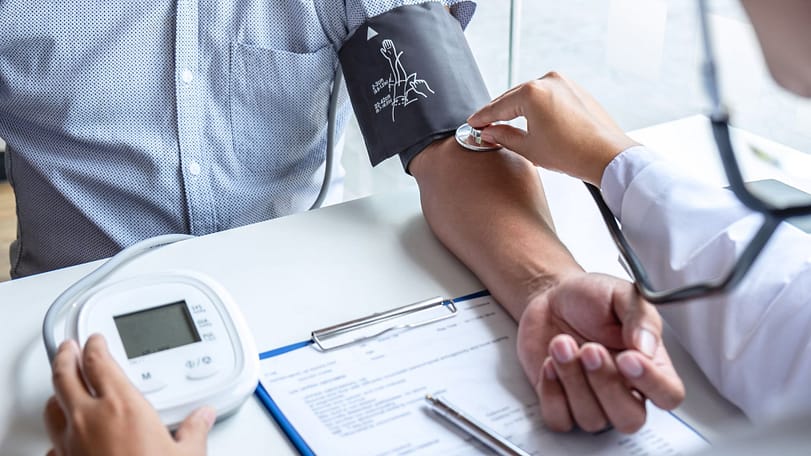 Doctor Checking Patient's Blood Pressure